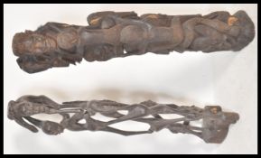 An early 20th Century African Tree Of Life ebony hand carved sculpture featuring figures being