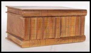 A vintage 20th Century Italian Sorrento ware puzzle box in the form of a stack of books, having