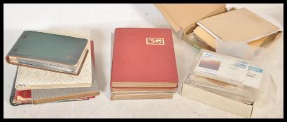 A large collection of stamps dating from the 19th Century, contained over several albums together