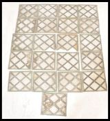 A set of 21 late 19th Century / early 20th Century leaded glass windows having cross leaded