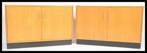 A pair of retro mid 20th Century beech wood low school / Industrial twin door cabinet /