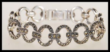 An early 20th Century Art Deco silver and marcasite set bracelet having circular hoop links with