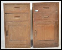 A pair of vintage 20th Century military bedside locker cabinets having a configuration of two