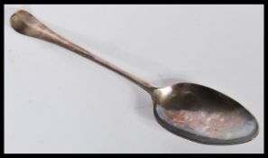 An 18th Century Georgian George II silver hallmarked tablespoon / serving spoon dating to