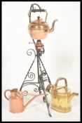 A vintage 20th Century Arts and Crafts copper spirit kettle raised on a wrought Iron stand