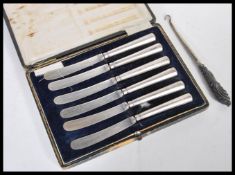 A cased set of vintage 20th Century silver hallmarked handled fruit knives, assay mark for Sheffield