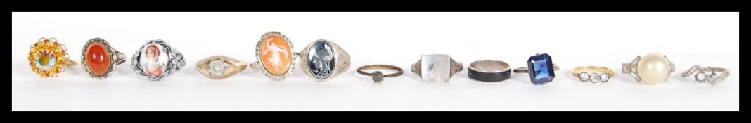 A collection of vintage 20th century rings to include a gold plated ring gypsy set with a white