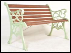 A very heavy 20th century cast metal garden bench, recently having new wooden slats added and a