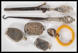 A 20th Century selection of silver and related items to include a steel button hook with a