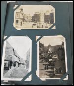 Postcards of British street scenes (180) in tatty old fashioned album. Antique and vintage.
