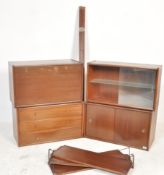 A retro 20th Century teak wood modular wall system by Remploy, the modular system having a series of