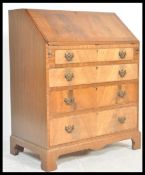 A 20th Century Georgian revival flame mahogany bureau, full front with fully appointed interior over