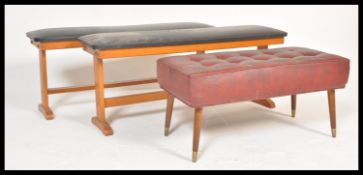 A pair of retro 20th Century beech-wood dining benches, beech frames with overstuffed black vinyl