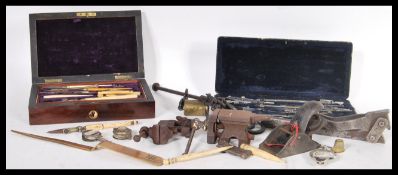 A collection of vintage items to include two cased math draughtsman sets, aeroplane tol stamped 838,