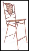 A 20th century country house style folding tennis umpires chair. The painted metal frame with
