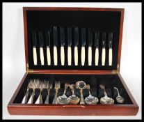 A canteen of cutlery including Kemp Bro stainless steel cutlery and George Butler & Co handled