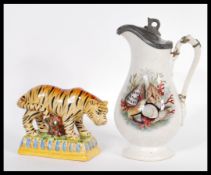 A 19th Century Victorian Prattware jug having transfer printed shells to the sides having a pewter