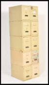 A set of ten vintage retro 20th Century Industrial metal upright filing cabinets in a cream enamel