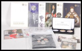 A collection of Royal mint decimal coinage to include 6x five pound coins on sleeves, a cased set of