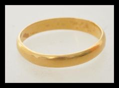 A hallmark 22ct gold wedding band ring. Hallmarked Birmingham 1921. Weight 2.3g. Size N.5.