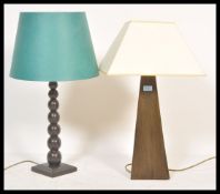 Two vintage retro 20th Century wooden Okra lamps one having a bulbous knopped column and the other