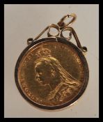 A 19th Century Victorian full sovereign dated 1890 set within a hallmarked 9ct pendant clasp.