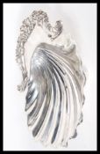 An early 20th Century hallmarked silver bowl in the form of a clam shell by Goldsmiths &