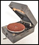 A vintage 20th century portable record player gramophone by Columbia having hinged lid with fitted