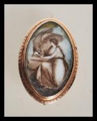 An 18th Century Georgian mourning brooch of oval form having a central panel with a hand painted