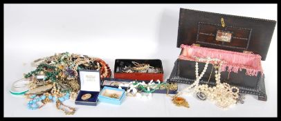 A collection of vintage costume jewellery to include a yellow metal bangle set with simulation