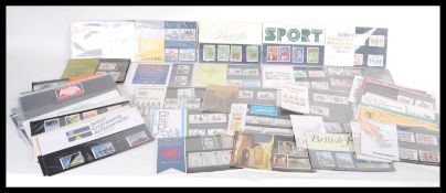 A collection of 20th Century stamp presentation packs 1st Day Issues (largely unused decimal) to
