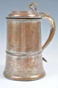 AN 18TH CENTURY COPPER TANKARD WITH HINGED LI.