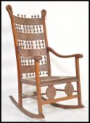 A 19TH CENTURY AMERICAN ARTS AND CRAFTS MOROCCAN MANNER ROCKING CHAIR IN THE CARLO BUGATTI STYLE