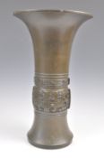 AN EARLY 20TH CENTURY JAPANESE BRONZE GU VASE