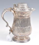 A 19th Century Victorian silver plated ale jug by Martin Hall & Co Sheffield raised on a circular