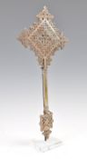 A 19TH CENTURY ETHIOPIAN COPTIC CROSS ON STAND.