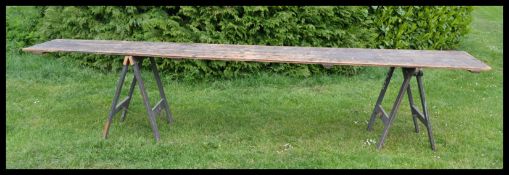 A large vintage 20th century wooden industrial fair / fete trestle ( dining ) table. Of very