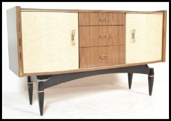 A retro 20th Century laminated two tone sideboard credenza, having a central bank of three drawers