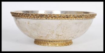 A sterling silver 925 stamped centerpiece bowl raised on an embossed gilded foot with decorative