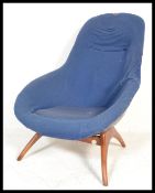 A vintage retro 20th Century Lurashell bucket tub egg space age chair raised on fibreglass base with