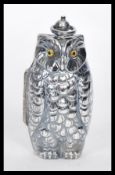 A silver plated sovereign / coin case in the form of an owl, having a hinge opening with