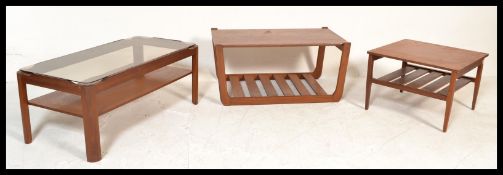 A group of three retro 20th Century teak wood coffee tables, to include two by myers one with an
