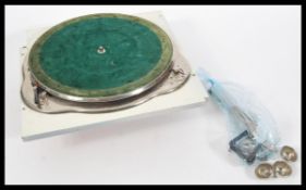 A vintage early 20th Century Garrard No. 11a motor with winding handle, set to later cabinet top.