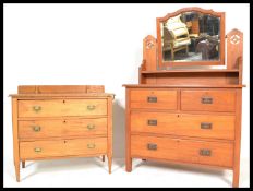 An early 20th Century oak dressing table chest having adjustable mirror over chest of drawers base