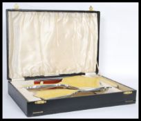 An early 20th century Art Deco dressing silver plated table set having yellow guilloche enamelled