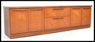 A retro 20th Century teak wood low sideboard / credenza by G Plan, central bank of two drawers