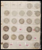 A collection of coins across two albums containing Victorian and early 20th Century silver and