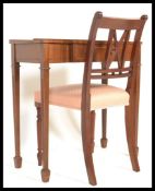 A 20th Century Georgian Style Regency Revival flame mahogany inlaid writing table desk with