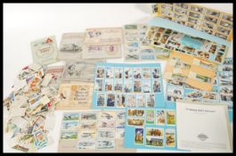 A collection of vintage early 20th Century cigarette cards to include albums of Wills cards Radio