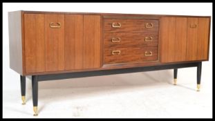 A mid 20th Century G-Plan Librenza model sideboard / credenza, having a central bank of three